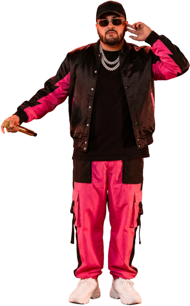 Pink92 in black and hot pink streetwear, listening to the crowd with a microphone in hand