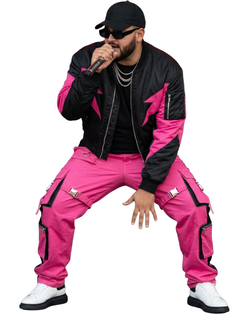 Pink92 leaning forward and singing into a microphone in black and hot pink streetwear